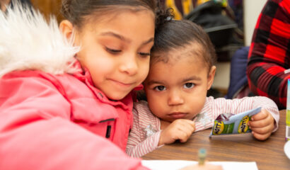 Two children coloring