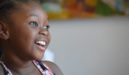 Young girl smiling and looking to the right