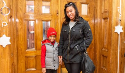Mom and son standing inside a doorway