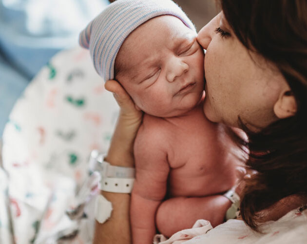 mother holding new born baby