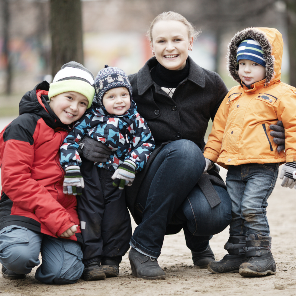A mom and her three sons.