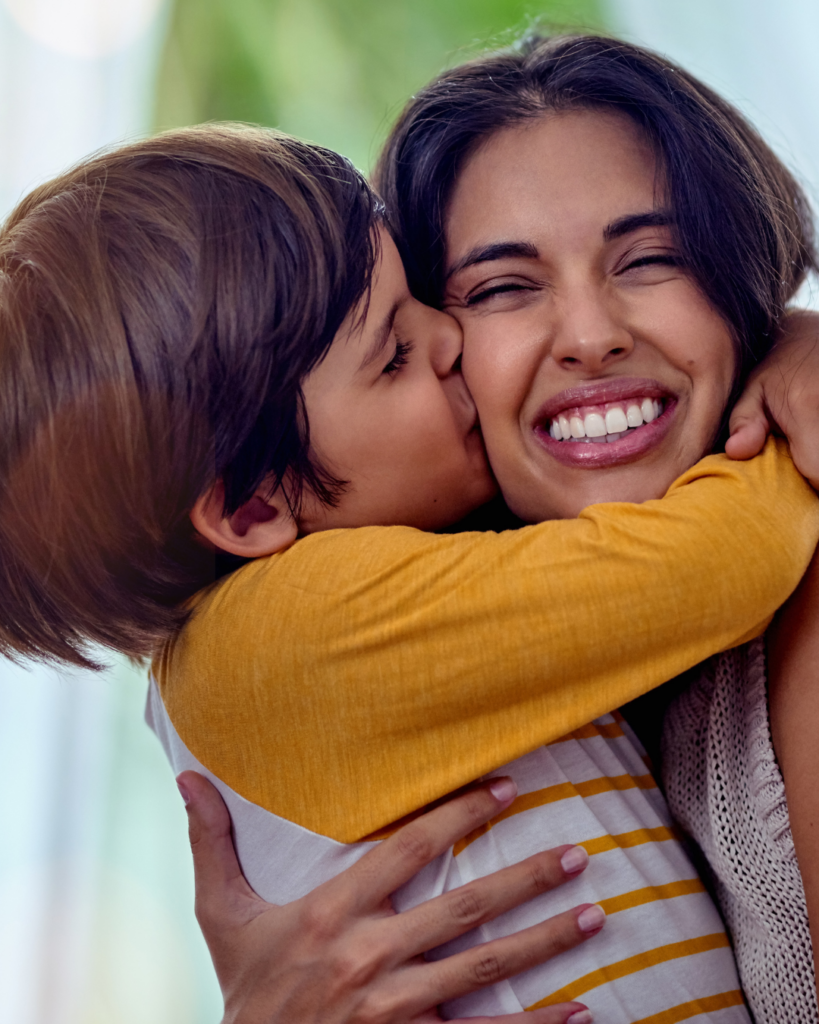 mom and son hugging